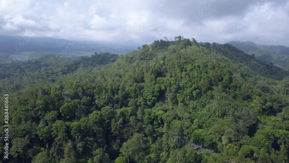Flying around a forested hill. Java Indonesia Flying around a forested hill. Java Indonesia