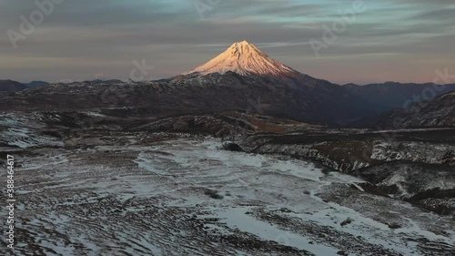Autumn on Russia's Kamchatka Peninsula, the stunning Vilyuchik Volcano, with impressive skies and clouds.
