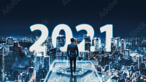 Photography New year 2021 business man on future network night city