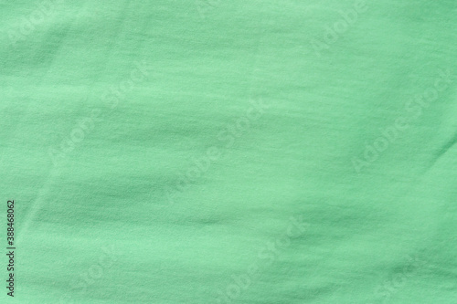 Green color fabric texture background, close up