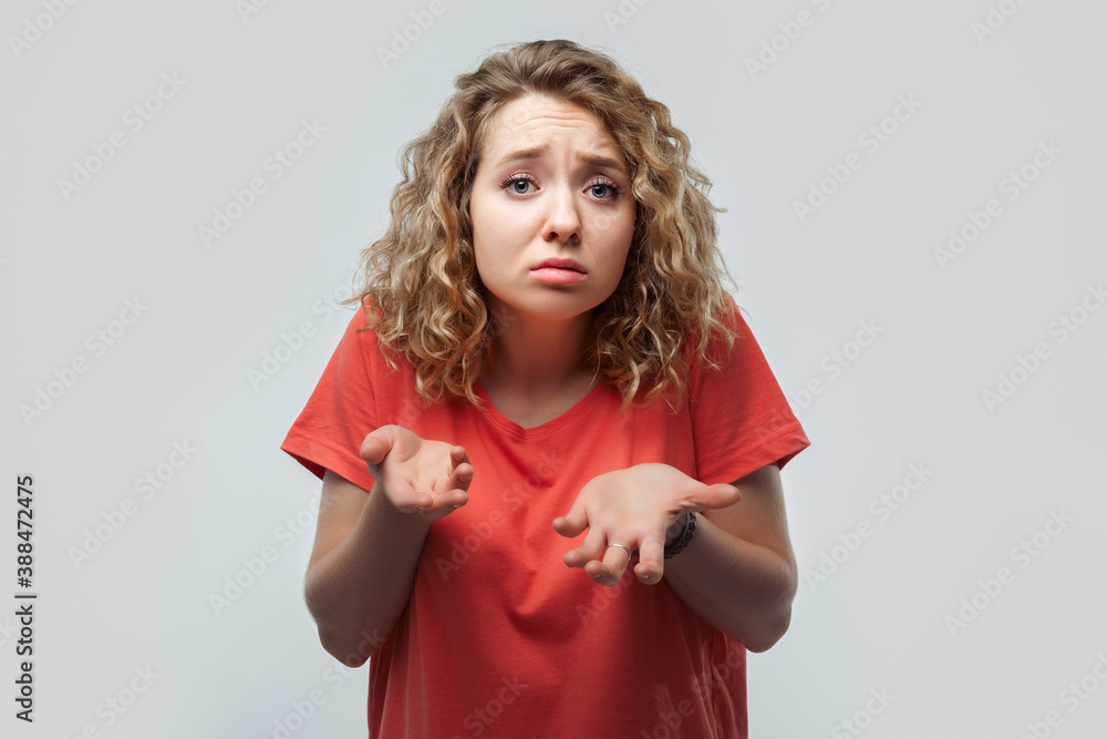 Image of shocked blonde girl expressing surprise on camera. Human emotions, facial expression concept Image of shocked blonde girl expressing surprise on camera. Human emotions, facial expression concept
