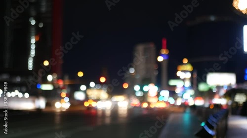 Defocused fabulous Las Vegas Strip boulevard, luxury casino and hotel, gambling area in Nevada, USA. Nightlife and traffic near Fremont street in tourist money playing resort. Neon lights of sin city.