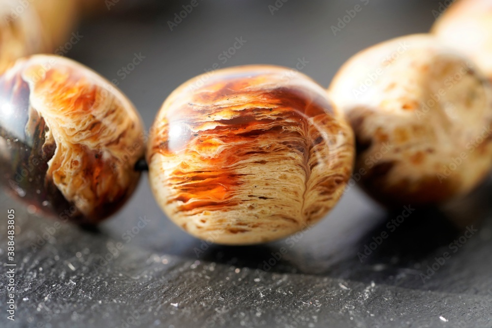 Obraz premium Close up view on brilliant natural rounded amber stones in sun light