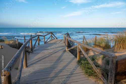 Broadwalk to a sand beach at Mediterranean ocean in Spain