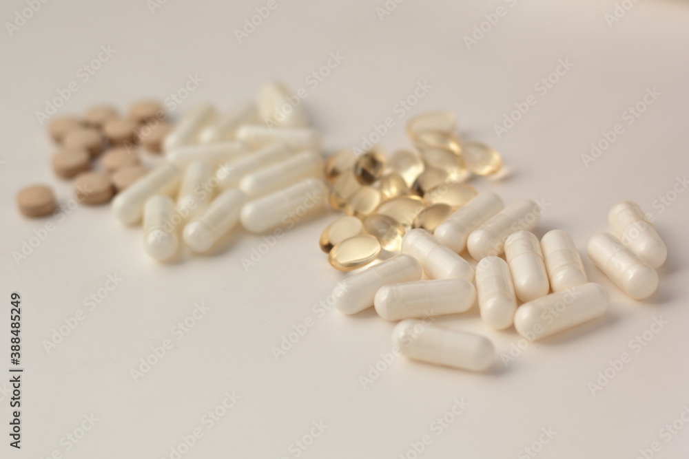 Closeup of supplements for PCOS - NAC (N-acetylcysteine), myo-inositol, vitamin D3 and milk thistle.