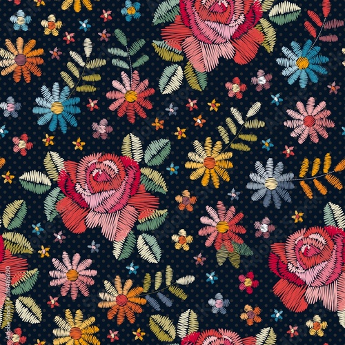 Embroidery seamless pattern with beautiful colorful flowers and leaves.  Fash...