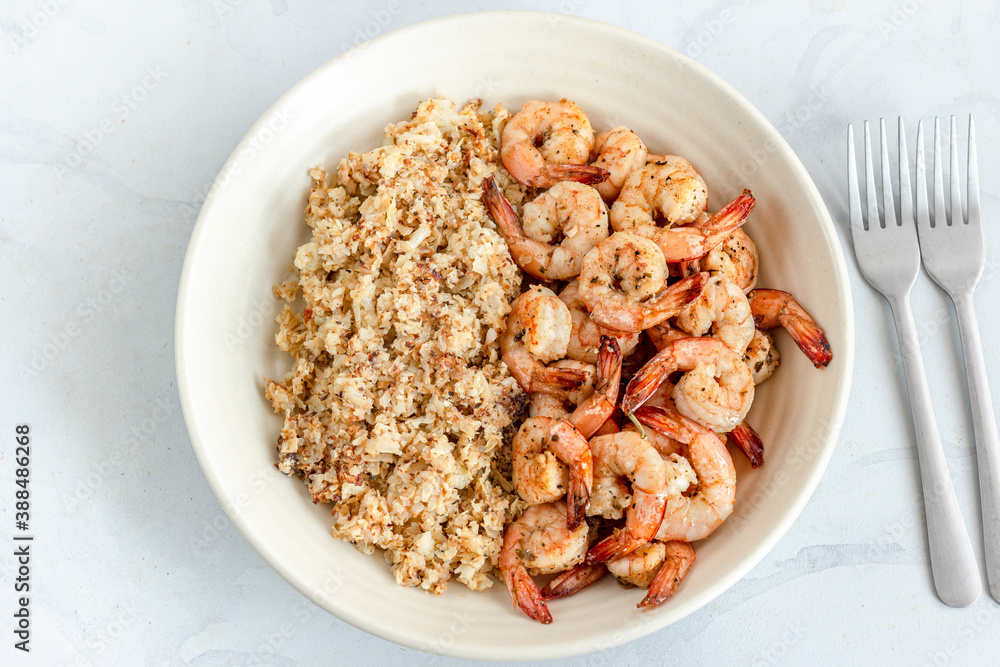 Cauliflower Rice and Sautéed Shrimp with Forks Directly Above Photo Cauliflower Rice and Sautéed Shrimp with Forks Directly Above Photo