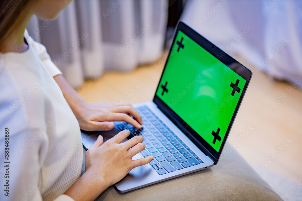 woman use laptop with greenscreen. woman use laptop with greenscreen.