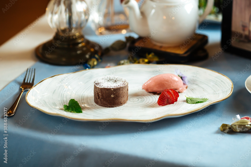 Gourmet chocolate dessert with pink icecream