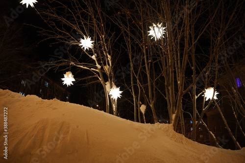 christmas lanterns in the night winter snow-covered park