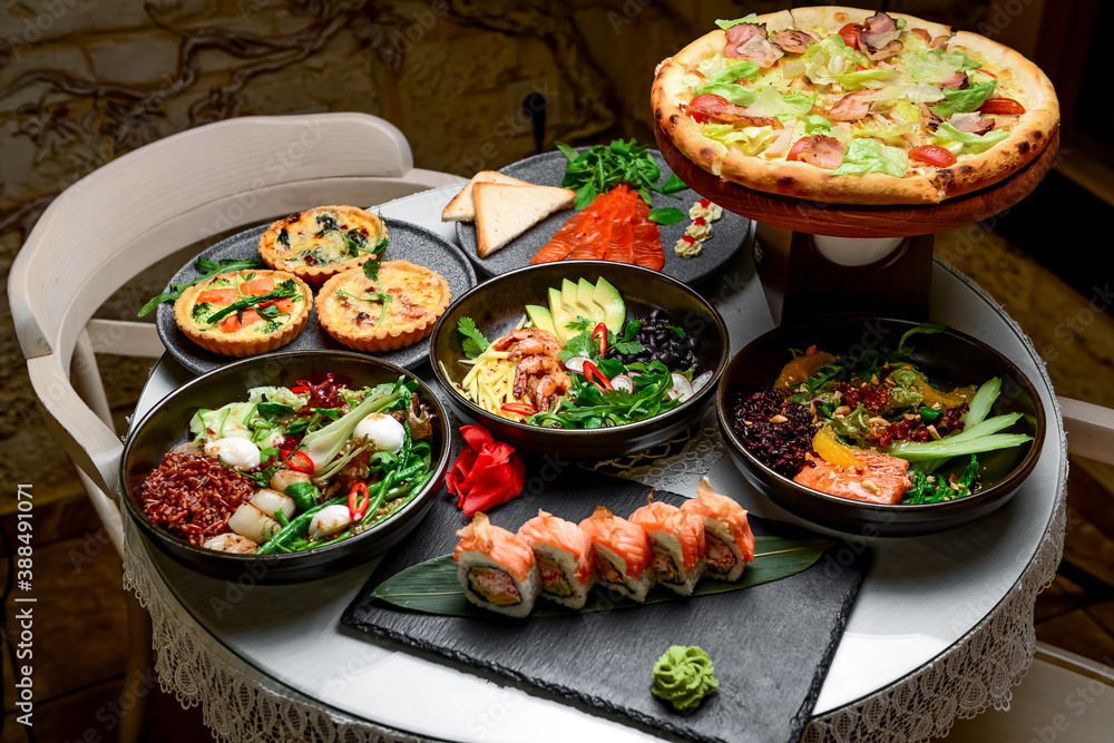 Mixed food, there are different dishes on the table Mixed food, there are different dishes on the table