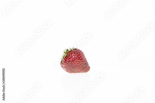 red raw fresh strawberry on white background, close view 