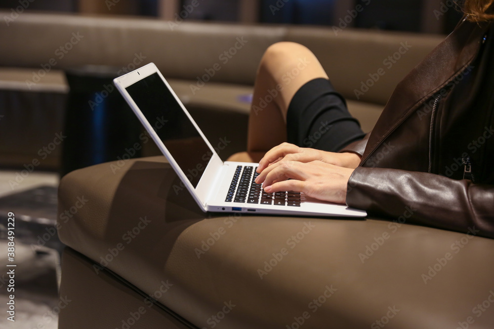 blogger's hands are typing on laptop in the waiting room blogger's hands are typing on laptop in the waiting room
