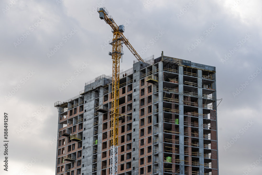 Construction site with cranes on sky background Construction site with cranes on sky background