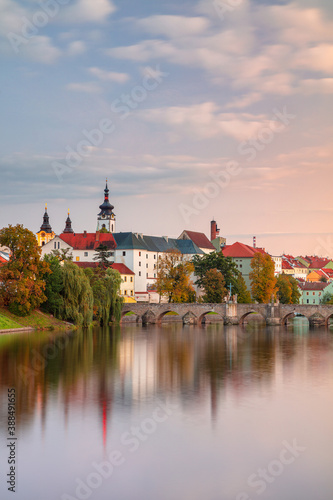 Obraz na płótnie Pisek, Czech Republic. Cityscape image of Pisek with famous Stone Bridge at beautiful autumn sunset. w salonie