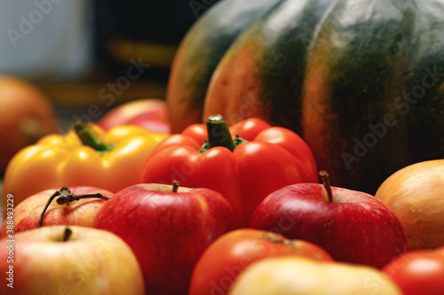 Fototapeta Naklejka Na Ścianę i Meble -  Close up of scattered vegetables of pumpkin, pepper and apples