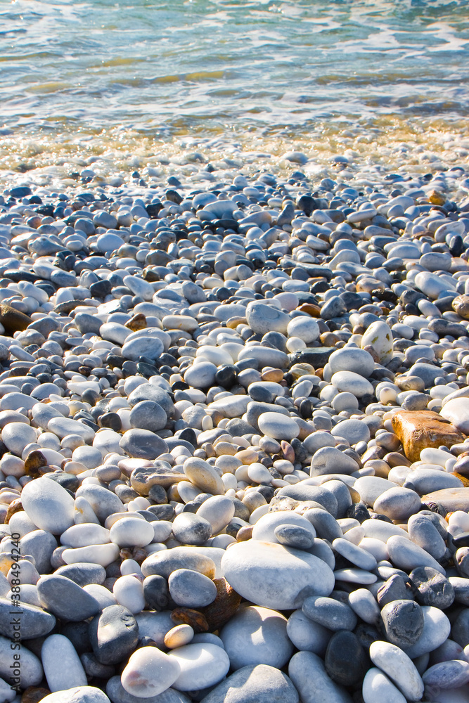 Rounded and smooth pebbles wet by seawater Rounded and smooth pebbles wet by seawater