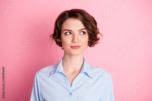 Closeup photo of attractive amazing pretty lady good mood smiling charming cute appearance look side empty space cunning wear blue office shirt isolated pink pastel color background