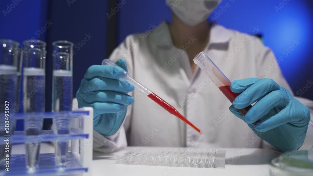 A doctor checks blood tubes for coronavirus. A doctor checks blood tubes for coronavirus.