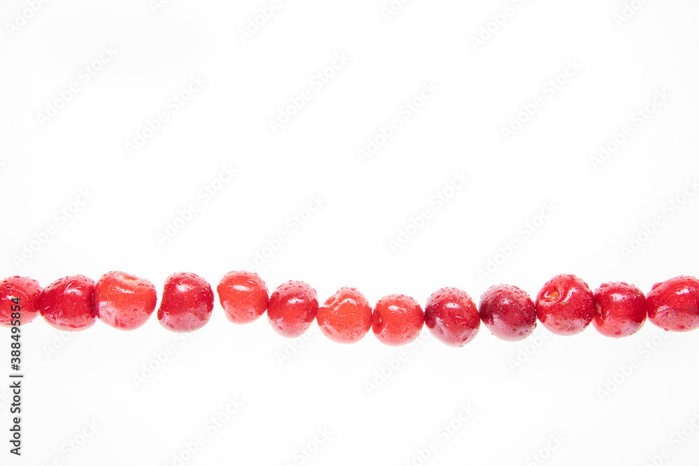 red raw fresh cherries on white background, close view red raw fresh cherries on white background, close view