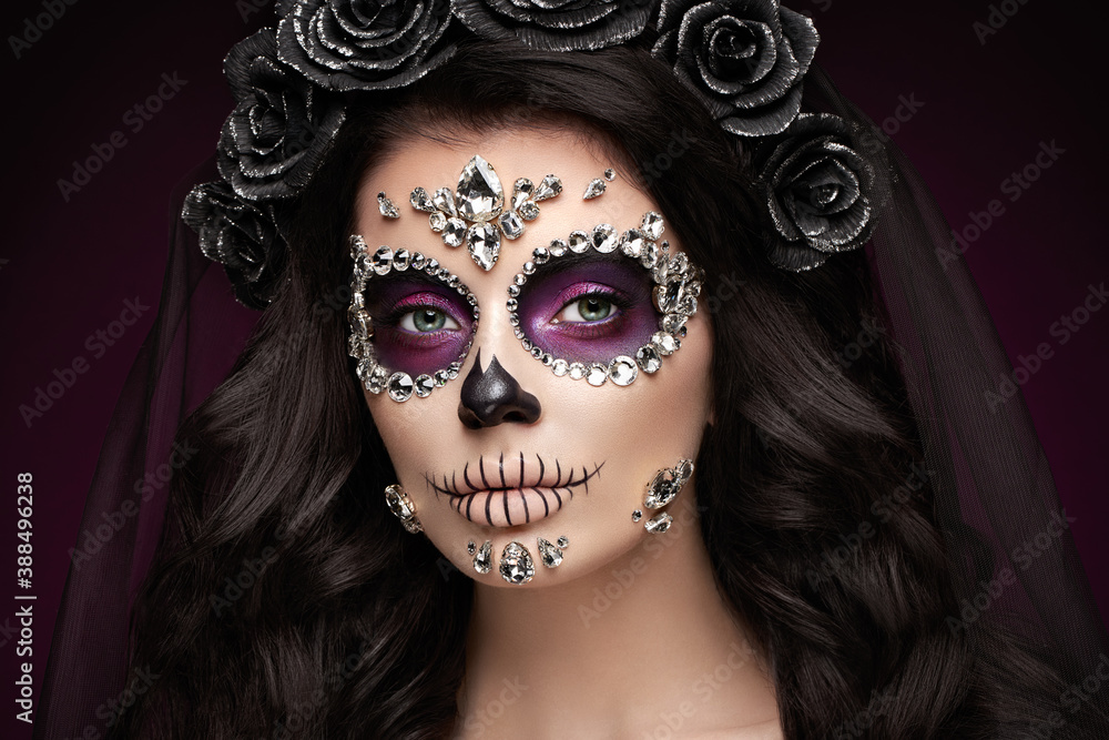 Portrait of a woman with sugar skull makeup over red background. Halloween costume and make-up. Portrait of Calavera Catrina Portrait of a woman with sugar skull makeup over red background. Halloween costume and make-up. Portrait of Calavera Catrina