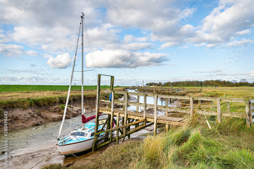 Boat moored on the Steeping River at low tide  Lincolnshire