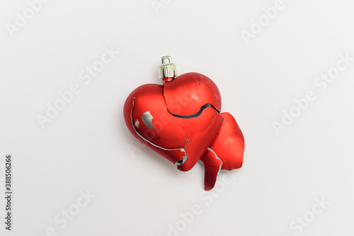 Konstfotografi Broken heart Red heart isolated on white background as symbol of break up in rel