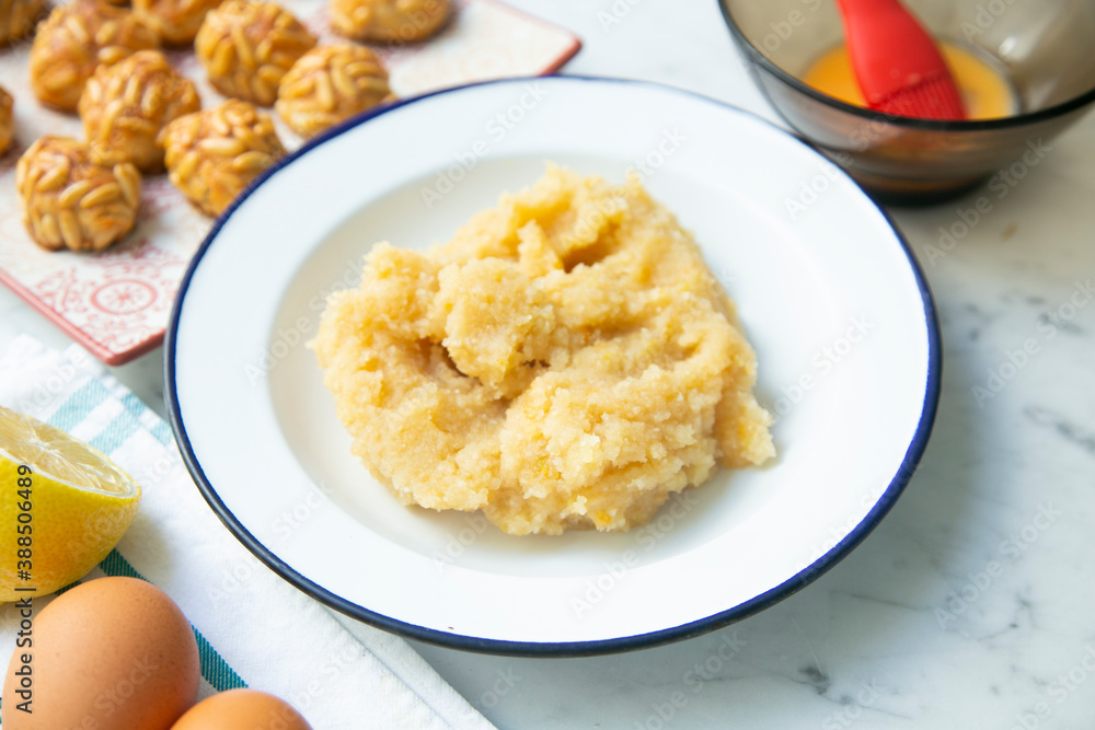 Almond and pine nuts Panellets . Traditional Catalan sweet made with potato, egg, sugar, almonds and pine nuts. Prepares to celebrate Halloween and November 1st Almond and pine nuts Panellets . Traditional Catalan sweet made with potato, egg, sugar, almonds and pine nuts. Prepares to celebrate Halloween and November 1st