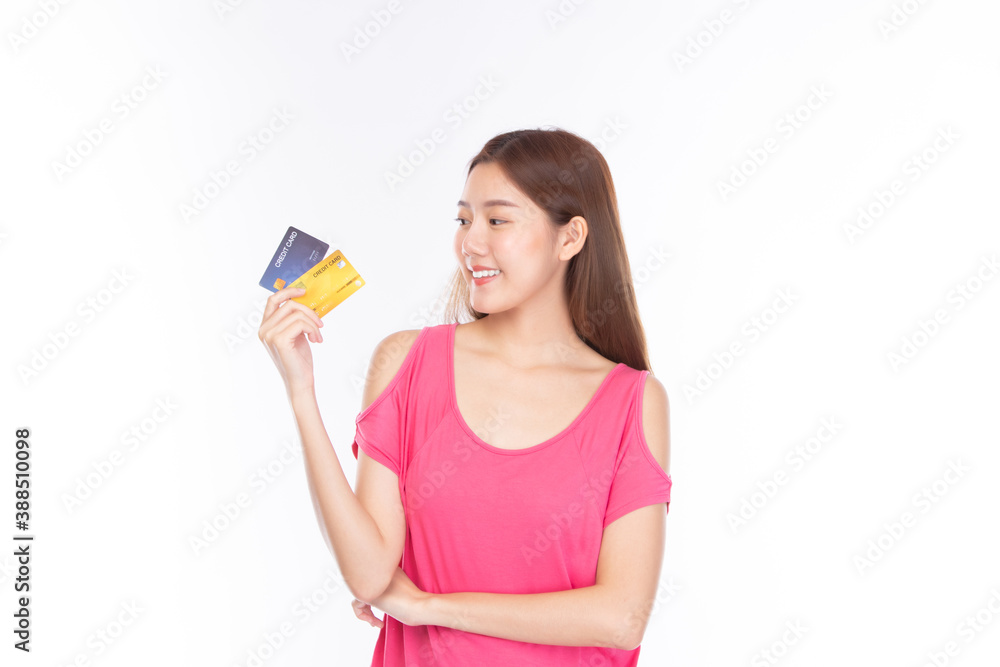 Portrait asian young girl happy and smile shopping online concept. Attractive beautiful asian young woman showing credit card for shopping online, payment on white background with copy space. Portrait asian young girl happy and smile shopping online concept. Attractive beautiful asian young woman showing credit card for shopping online, payment on white background with copy space.