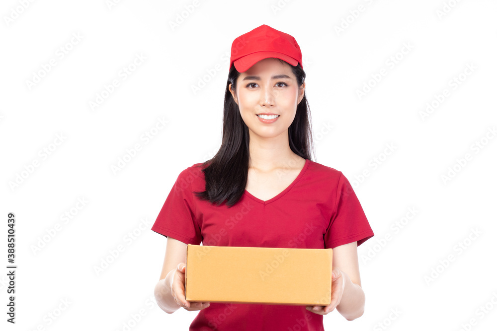 Happy young Asian woman delivery in red shirt standing with parcel post box isolated on white background. Happy young Asian woman delivery in red shirt standing with parcel post box isolated on white background.