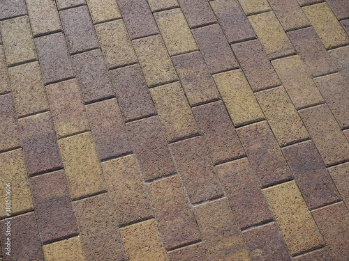 Paving stones made of natural stone. Paths for pedestrians. The view from the top.