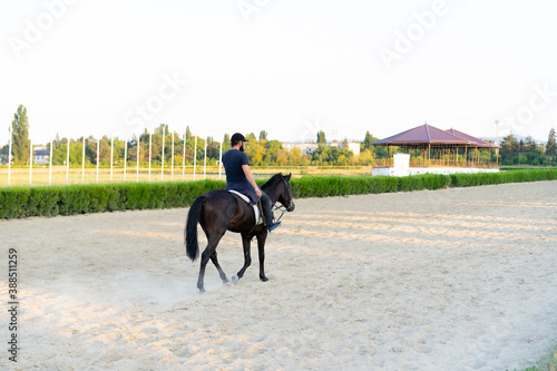 Man riding a horse at the racetrack