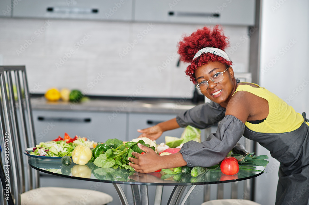 African american woman filming her blog broadcast about healthy food at home kitchen. African american woman filming her blog broadcast about healthy food at home kitchen.