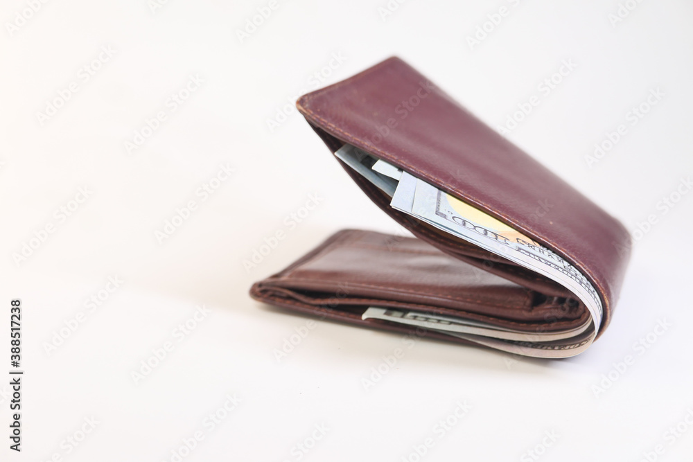 Close up of cash in wallet on table. Close up of cash in wallet on table.