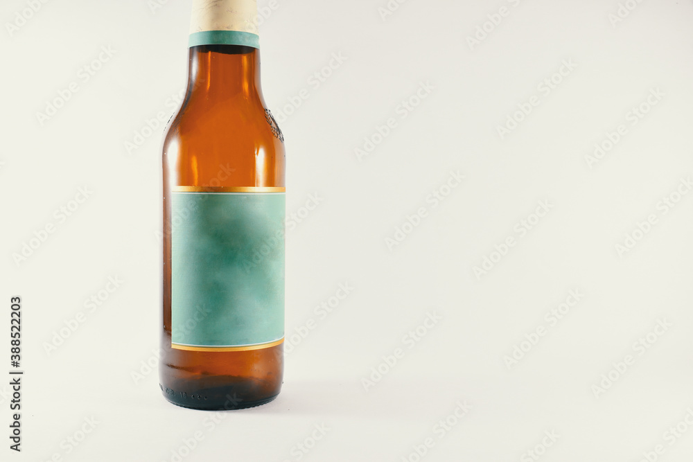 a bottle of beer with a light blue label on a white background a bottle of beer with a light blue label on a white background