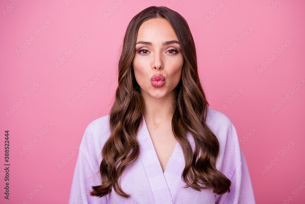 Closeup photo of beautiful tenderness lady long curly hairdo good mood send air kisses boyfriend look mirror lips shape correction wear bathrobe isolated pastel pink color background Closeup photo of beautiful tenderness lady long curly hairdo good mood send air kisses boyfriend look mirror lips shape correction wear bathrobe isolated pastel pink color background