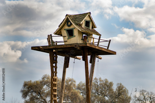 Bilde på lerret Tall tree house on a farm