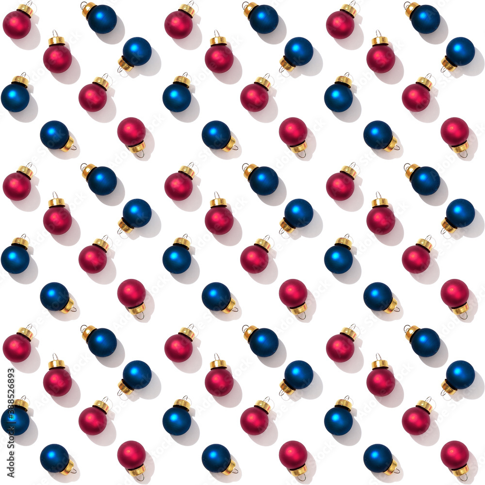 Seamless regular creative pattern with bright shiny little colorful Christmas balls isolated on white background. Printing on fabric, wrapping paper.