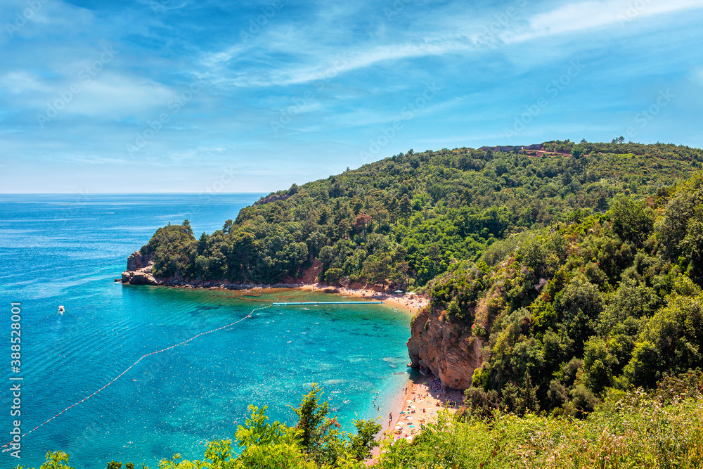 Obraz premium View from above to Adriatic sea coastline and Mogren beach in Montenegro, nature landscape and seascape, vacations to the summer paradise