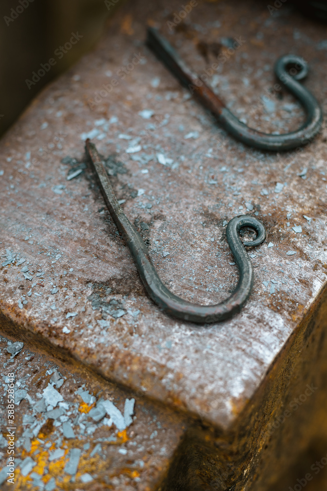 Fototapeta premium Rough forged hooks on an anvil