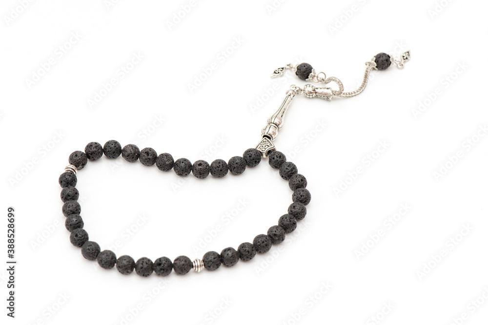 Turkish black rosary (Tespih) on the white background. Turkish black rosary (Tespih) on the white background.