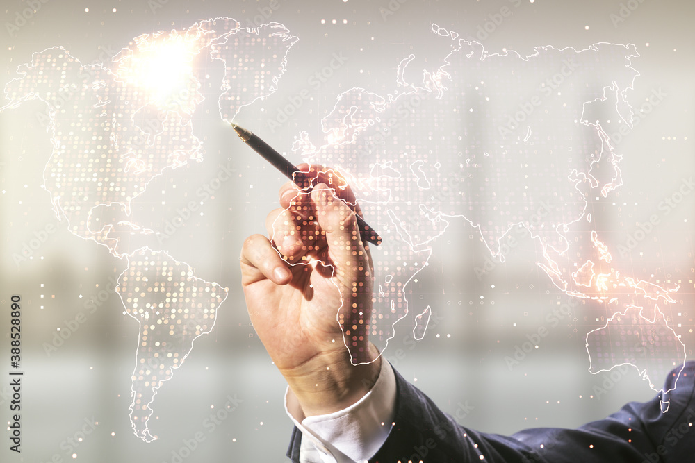 Double exposure of man hand with pen working with abstract digital world map on blurred office background, research and strategy concept Double exposure of man hand with pen working with abstract digital world map on blurred office background, research and strategy concept