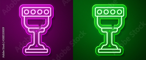 Glowing neon line Medieval goblet icon isolated on purple and green background. Holy grail. Vector.