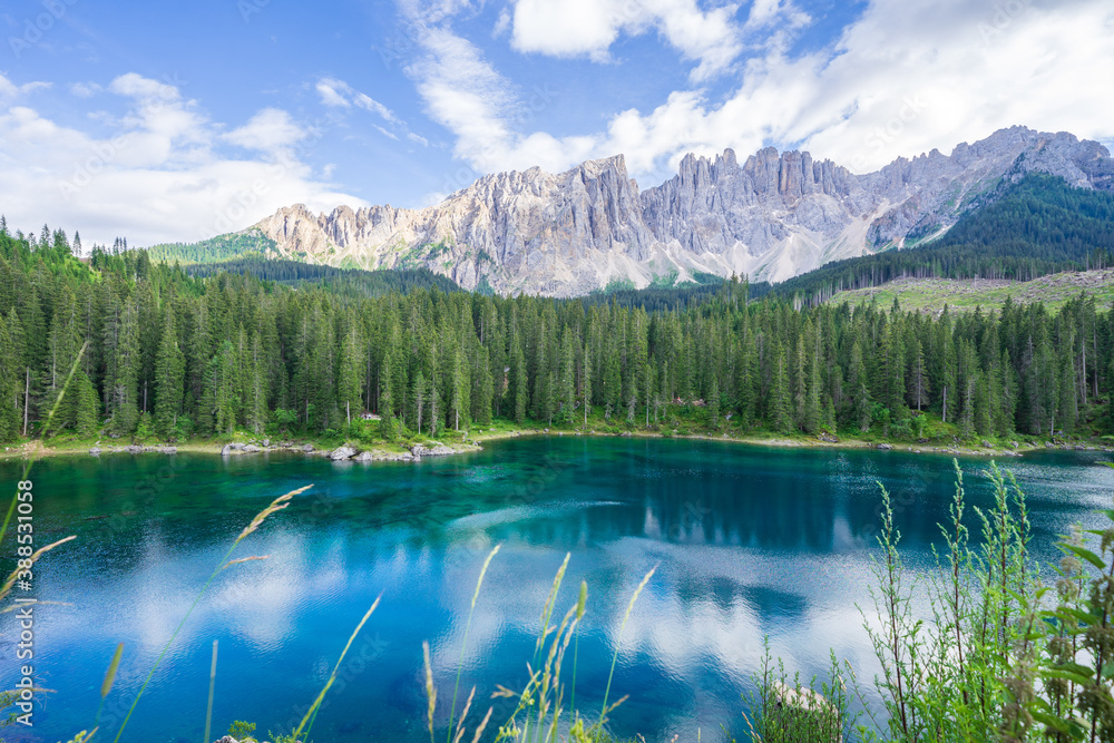 View Carezza lake, mountains in the back, Dolomites Alps. South Tyrol. Italy