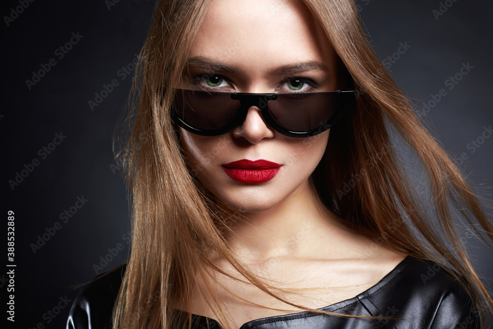 Beautiful young Woman in Sunglasses and leather Beautiful young Woman in Sunglasses and leather