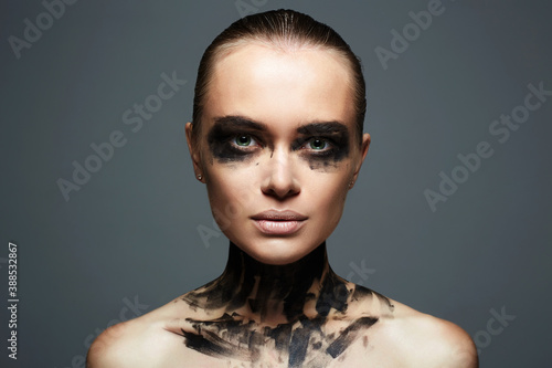 Beautiful Young woman with Paint on her Face photo