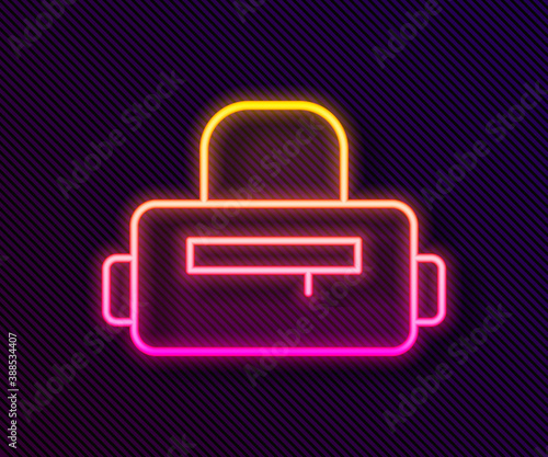 Glowing neon line Sport bag icon isolated on black background. Vector.
