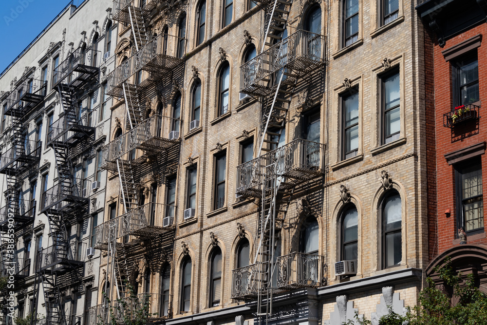 Row of Old Apartment Buildings in the East Village of New York City with Fire Escapes