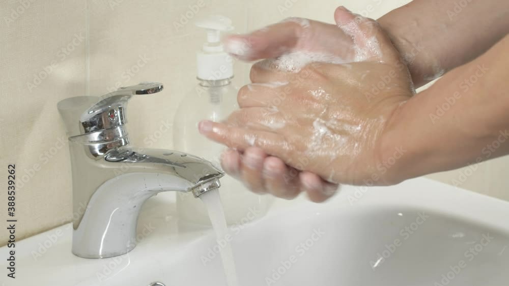 Man washing hands with sanitizer gel soap and water for prevention of coronavirus Covid-19 virus Man washing hands with sanitizer gel soap and water for prevention of coronavirus Covid-19 virus
