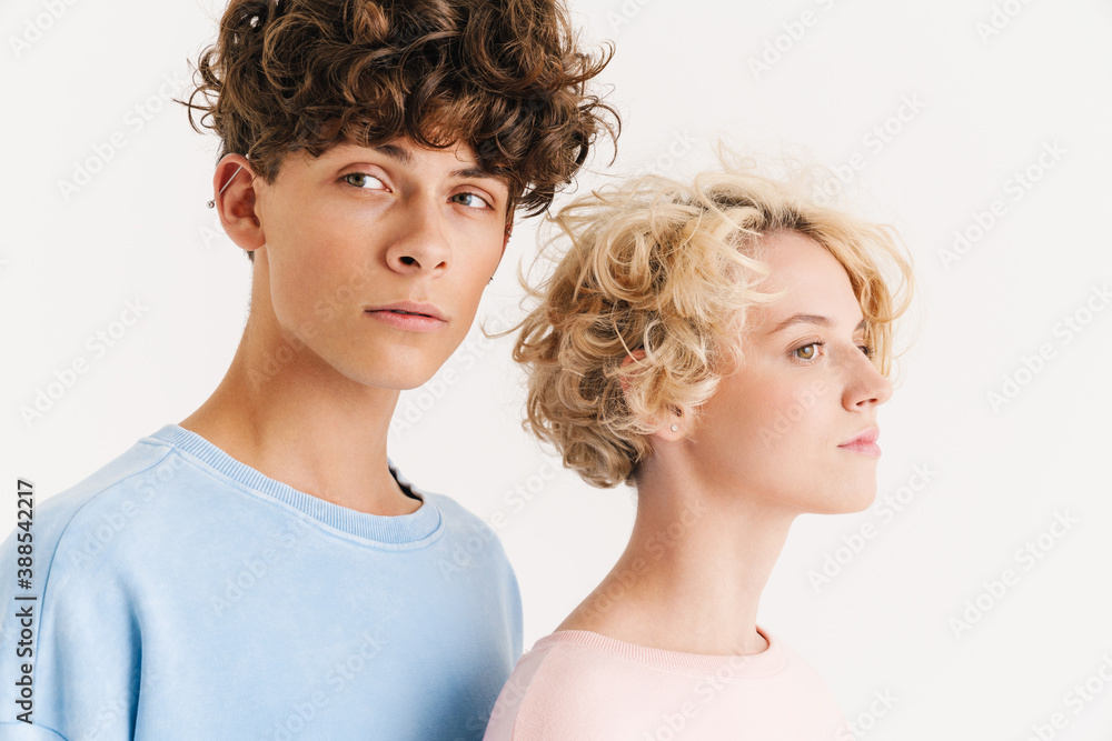 Loving couple posing isolated over white background Loving couple posing isolated over white background